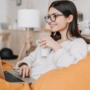 Woman blogging Using Laptop